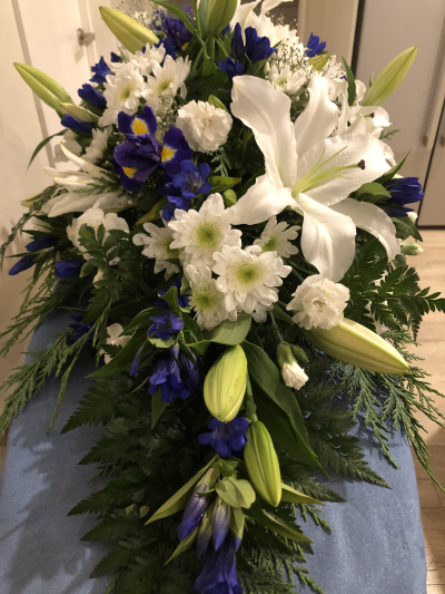 Blue Skies Farewell - A classic sympathy arrangement in calming shades, offering comfort, remembrance and a touching final tribute.