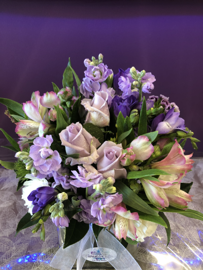 Lavender Whisper - A delicate arrangement in soft lilac and blush tones, beautifully designed to bring elegance, warmth and a gentle touch to any occasion.