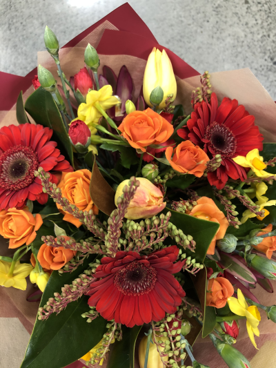 Autumn Ember - A vibrant hand-tied bouquet bursting with rich seasonal shades, expertly arranged to brighten celebrations and lift the spirits.