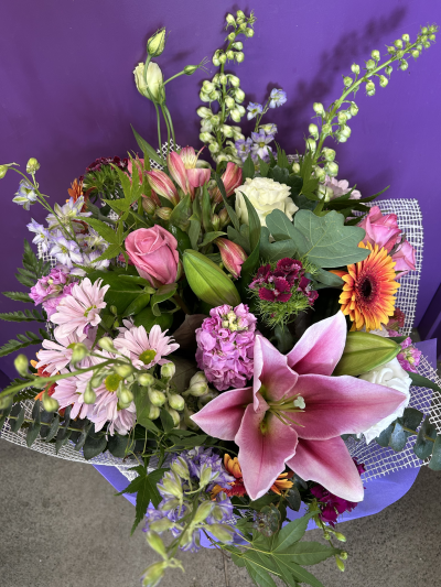 Garden Celebration - A cheerful bouquet inspired by a blooming country garden, filled with vibrant colours and natural charm for any special occasion.